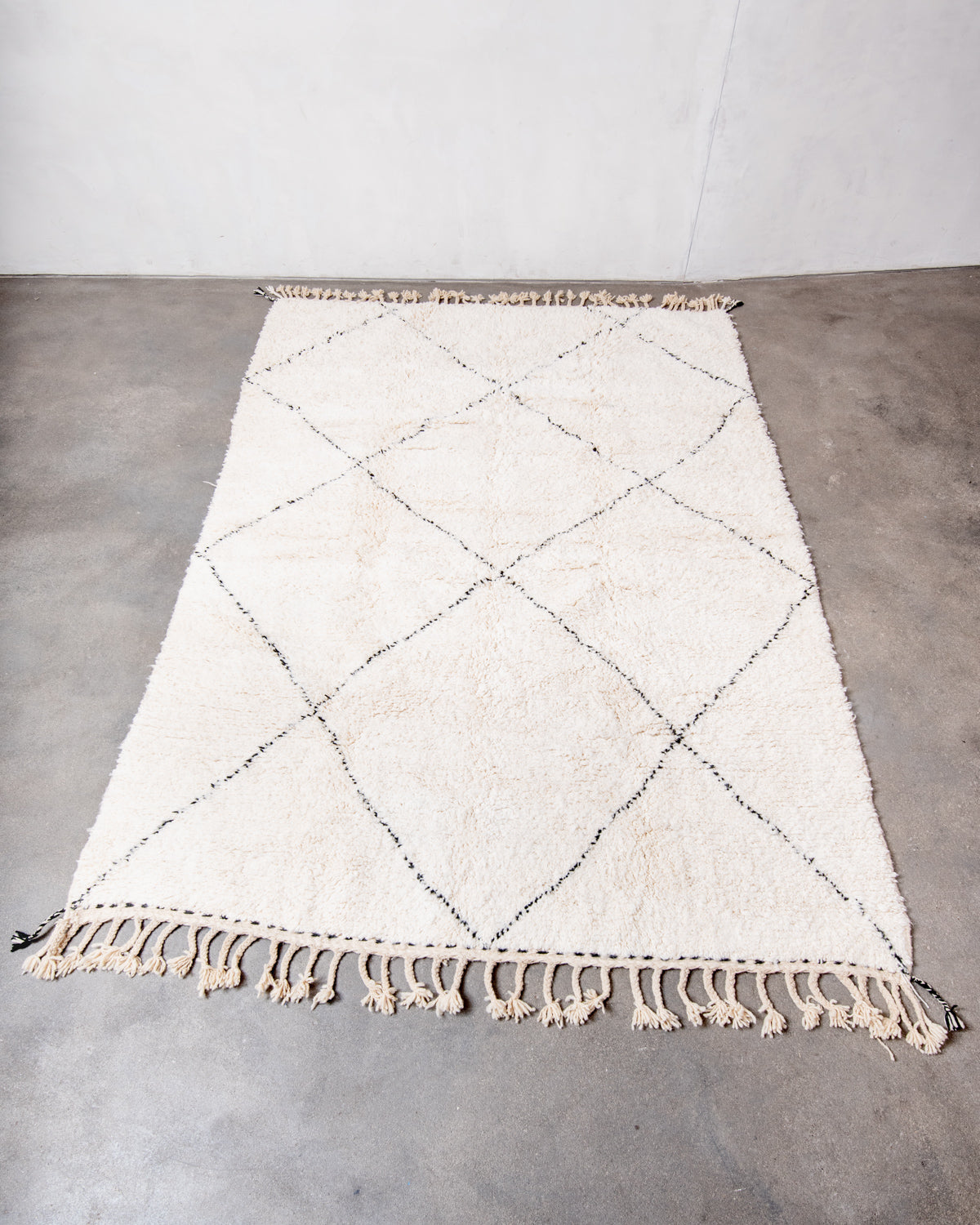 Modern, designer, handcrafted Berber rug from Morocco. Beniourain carpet with minimalist design, natural wool pile and a fluffy texture.
